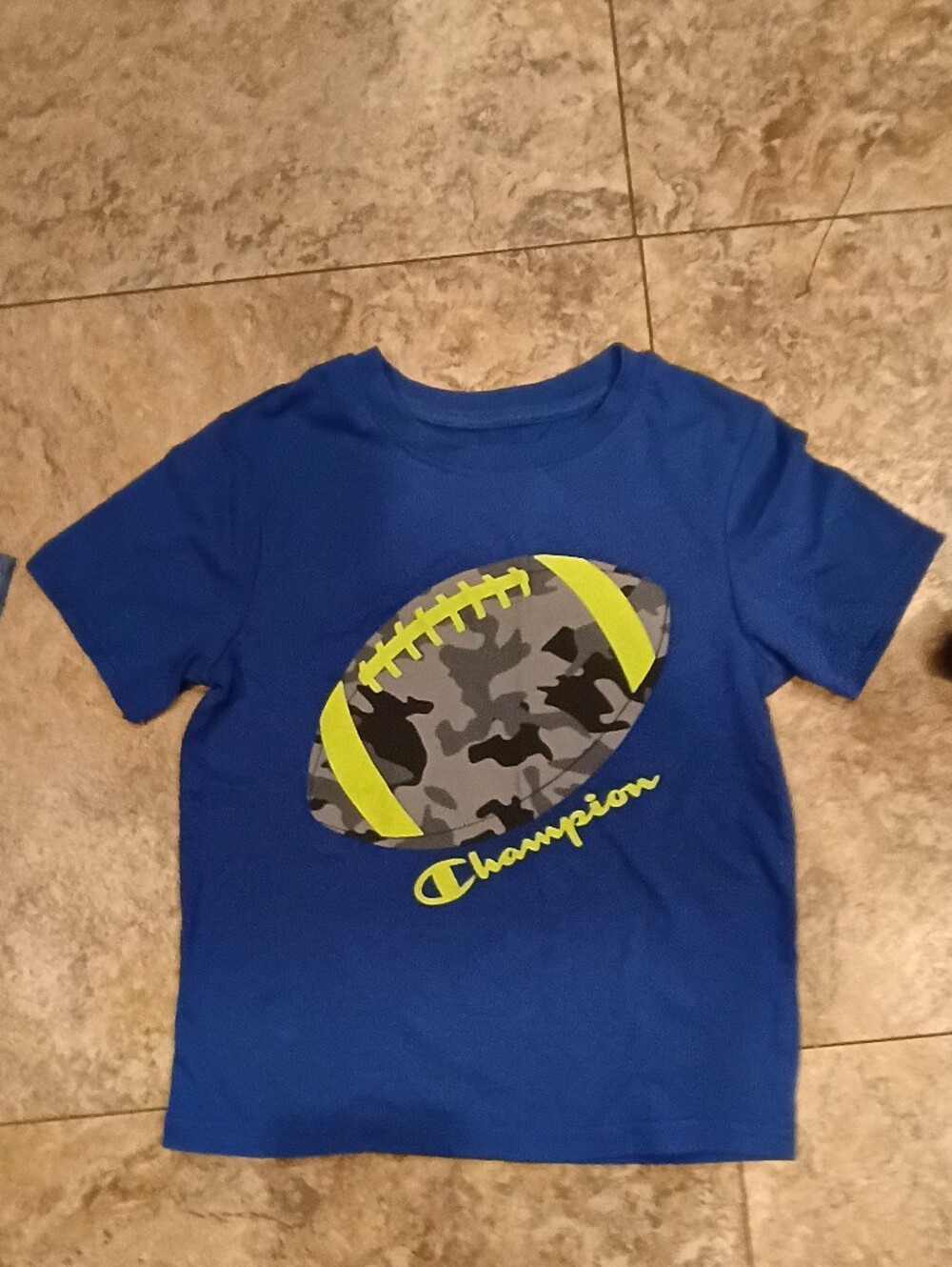 Champion Blue Kids Tee with Camo Football Graphic and Neon Accents